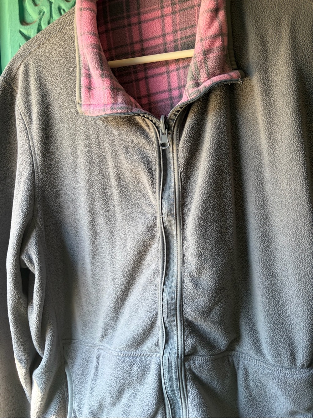 Reversible jacket, grey on one side and pink and grey plaid on other side